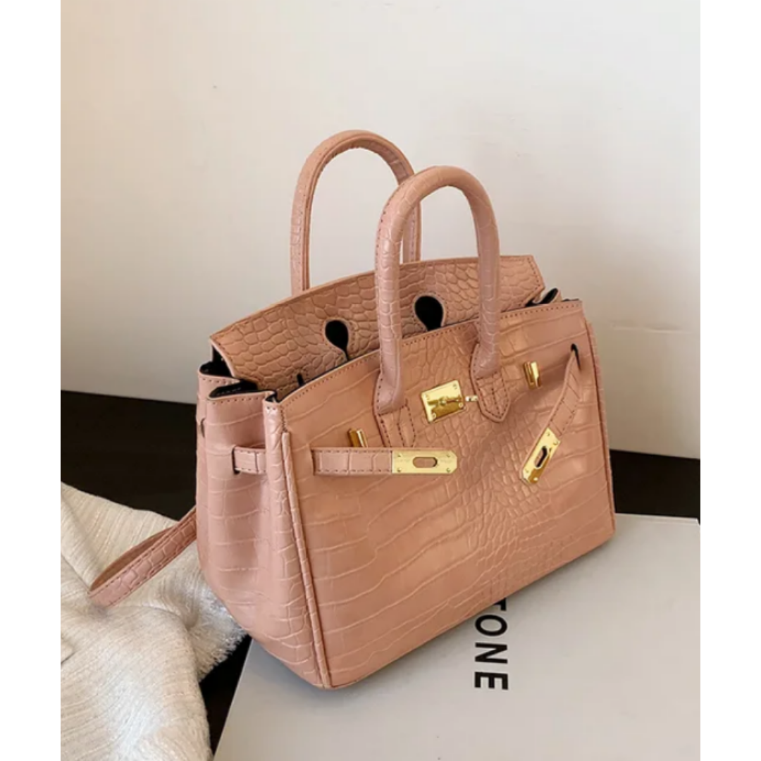 Large women's designer crossbody handbag, elegant structured silhouette with adjustable strap and ample storage