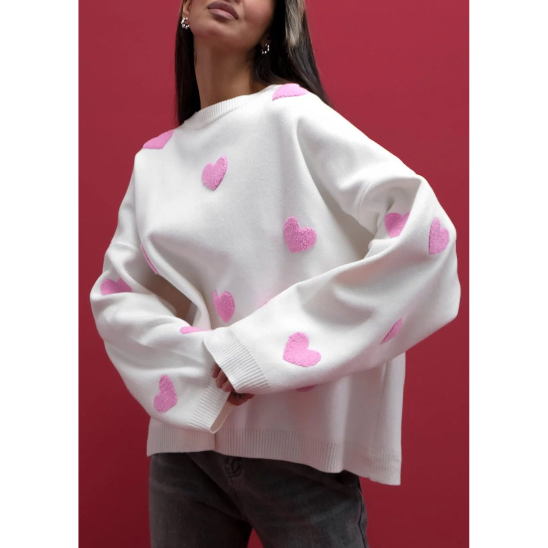 Women's beige knit sweater with allover heart pattern, relaxed cozy fit, classic romantic knitwear