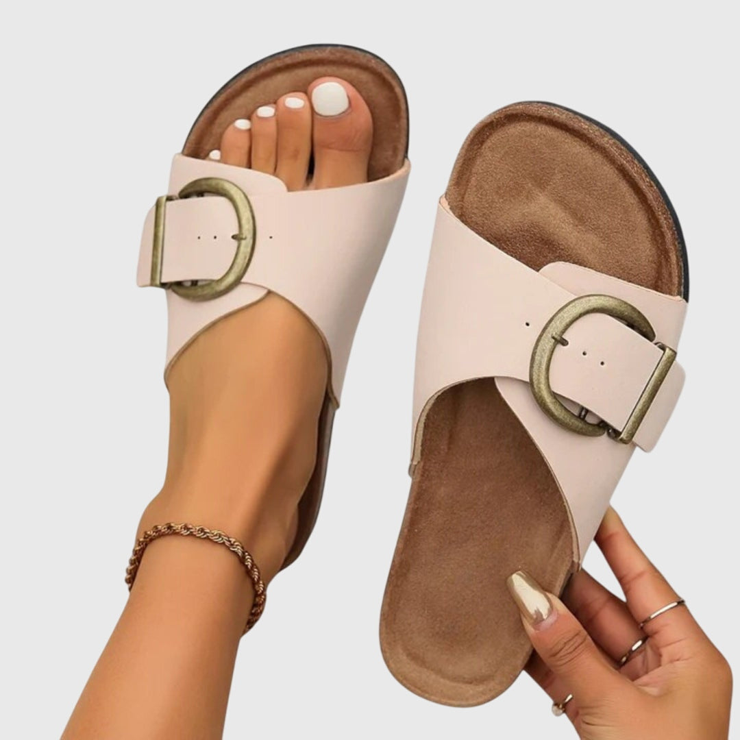 Women's beige slip-on sandals with wide buckle strap, casual flat style for everyday comfort
