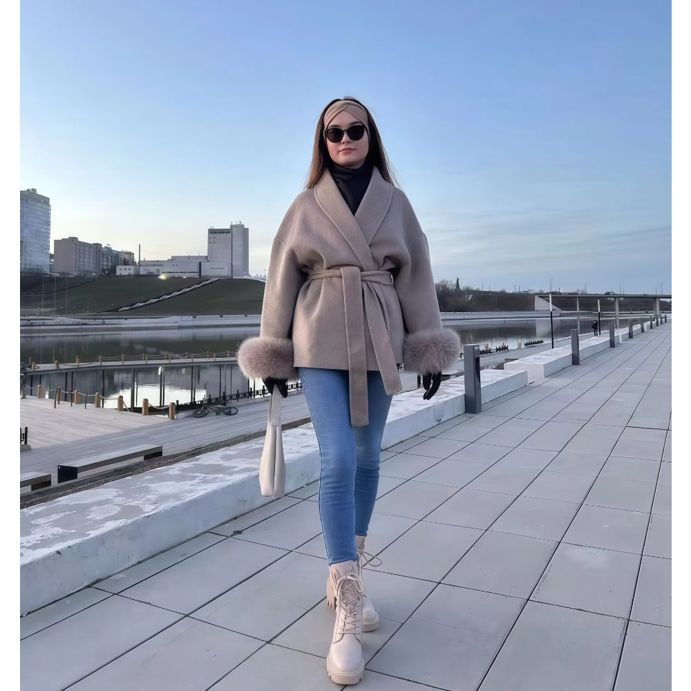 Women's belted faux fur sleeve coat cozy winter style with plush warmth and elegant silhouette