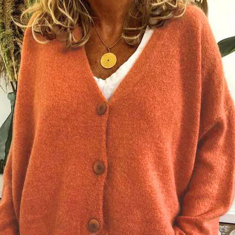 Women's loose fit v-neck knit cardigan in cozy soft fabric with classic button-front closure for effortless layering