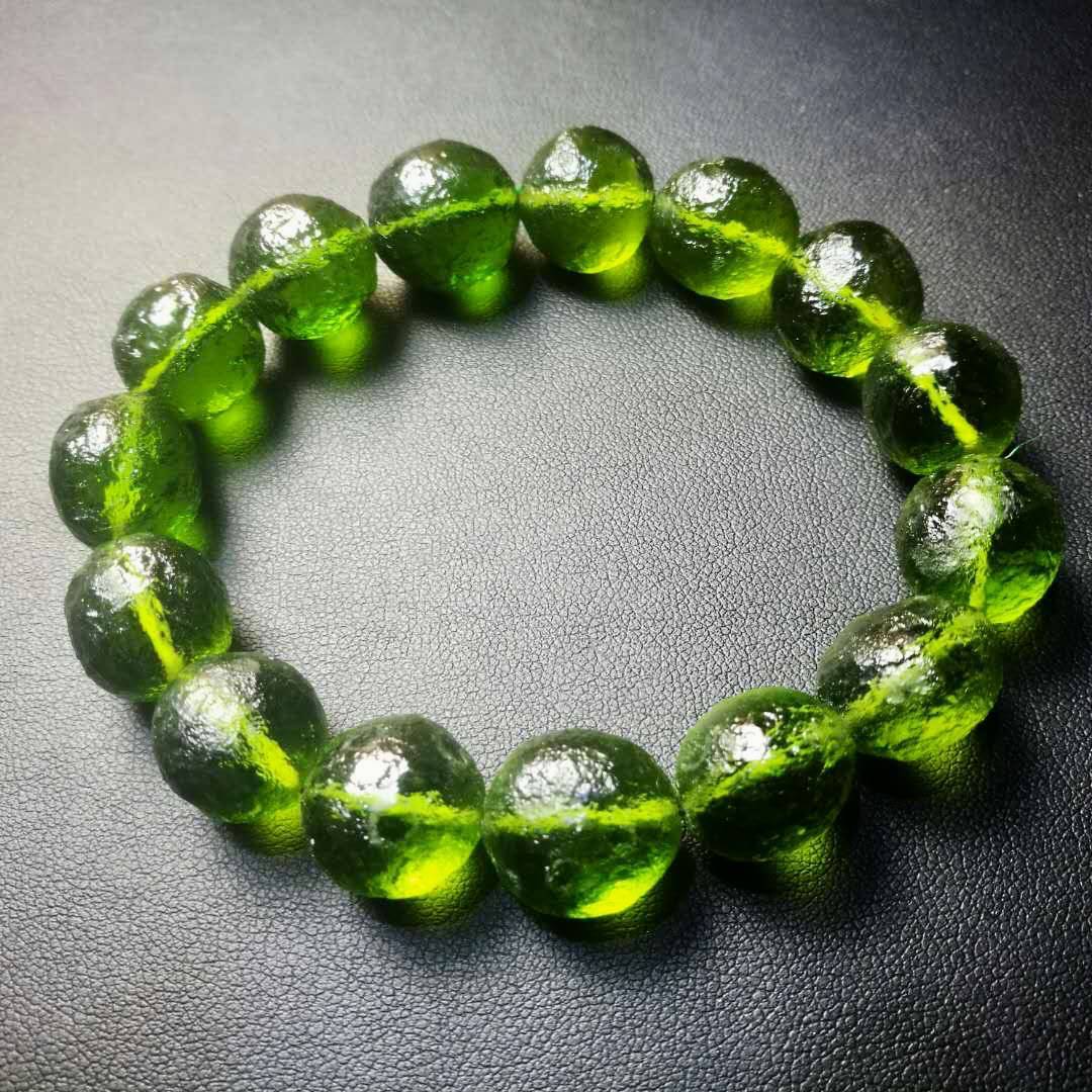 Women's green natural stone bracelet with polished beads, elegant spiritual jewelry with organic appeal