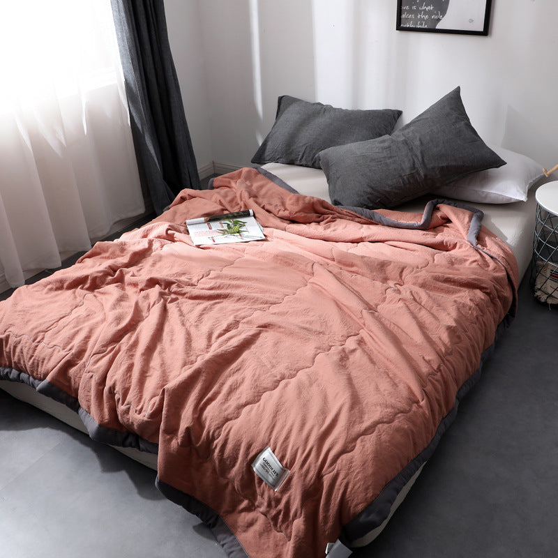 Minimalist cotton quilt blanket solid color lightweight all-season cloudlike soft texture modern bedroom
