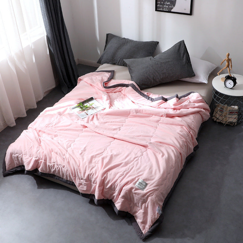 Minimalist cotton quilt blanket solid color lightweight all-season cloudlike soft texture modern bedroom