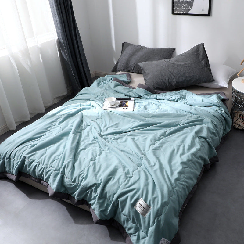 Minimalist solid-color cotton quilt blanket lightweight all-season cloudlike soft texture modern bedroom
