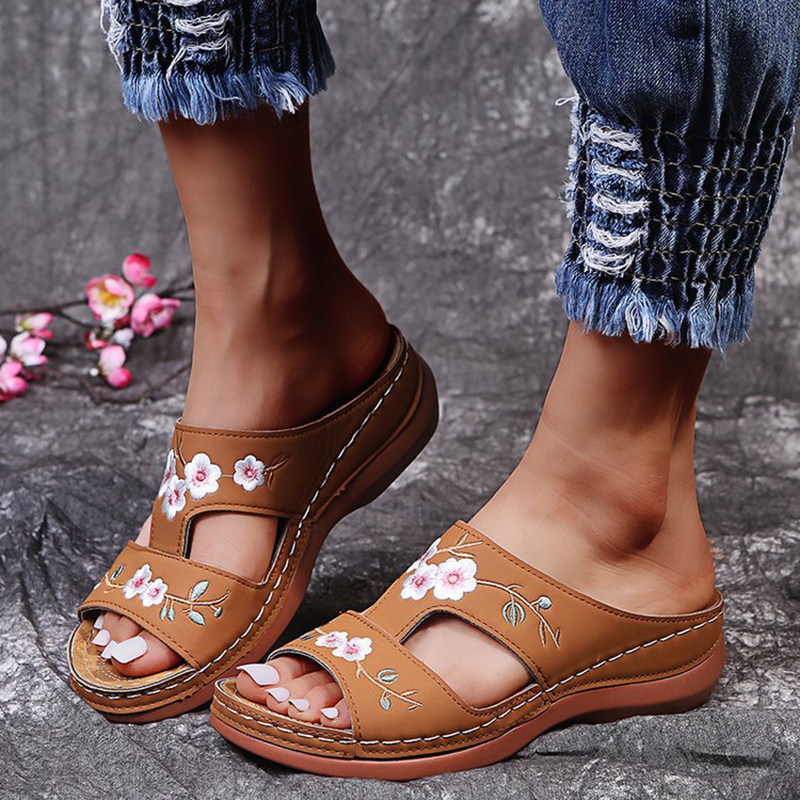 Women's beige orthopedic sandals with vintage floral embroidery, open-toe silhouette, and triple arch support