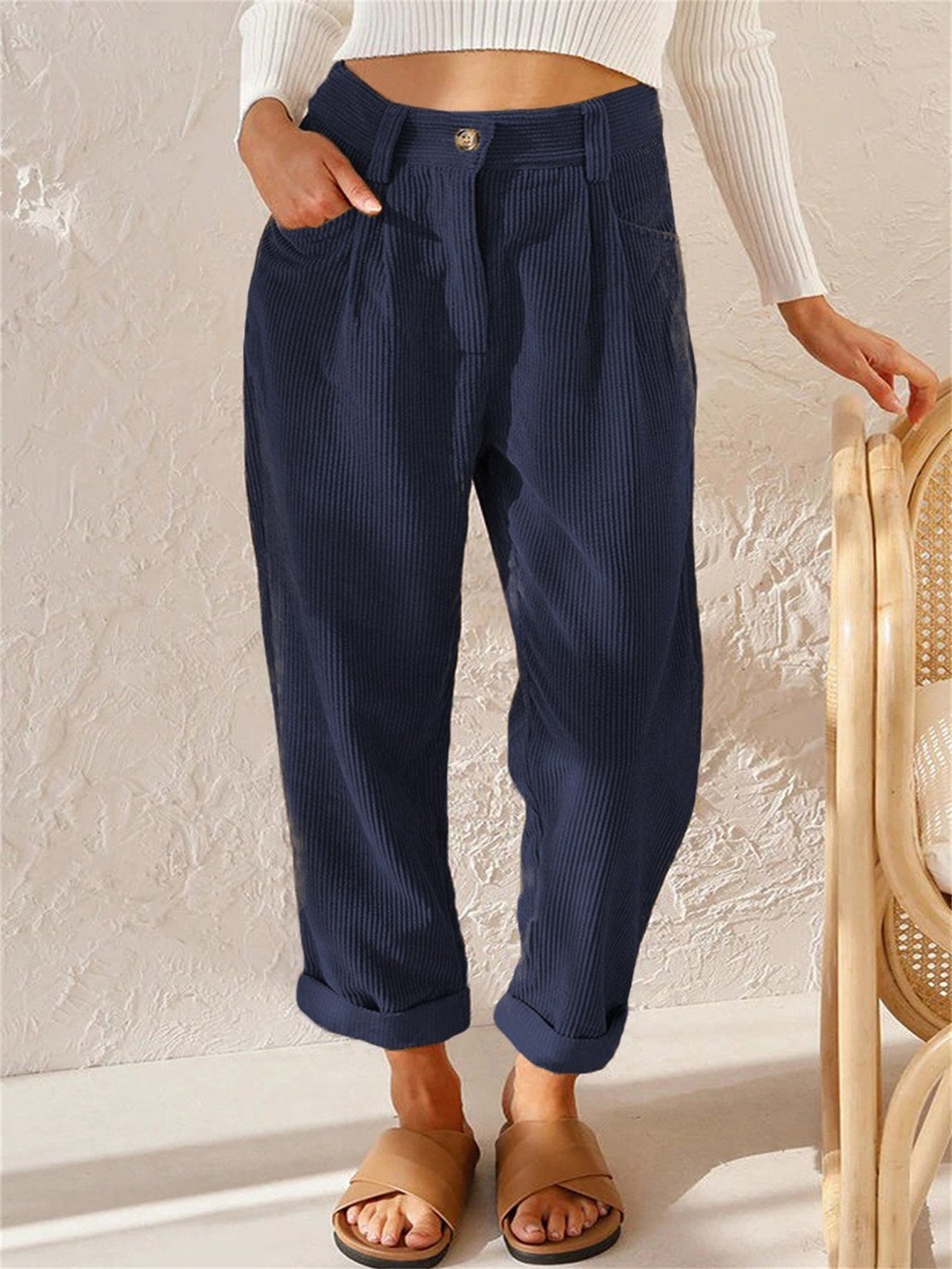 Women's brown corduroy straight-leg trousers with timeless elegant cut for office and casual wear