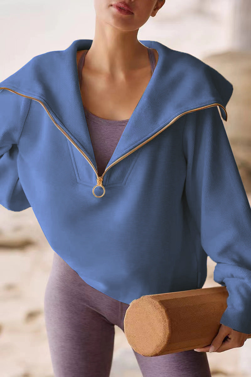 Women's relaxed-fit polyester sweater with fold-over collar and half zipper in versatile chic style