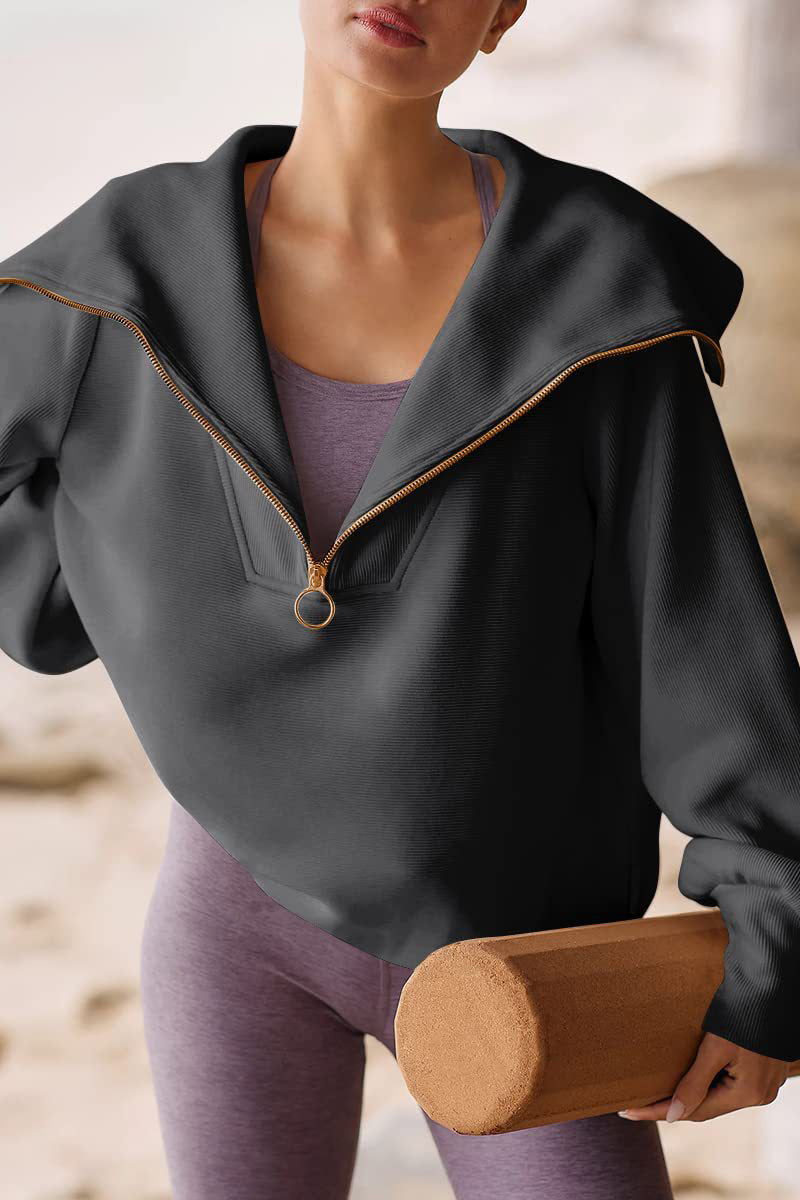 Women's relaxed-fit polyester sweater with fold-over collar and half zipper in versatile chic style