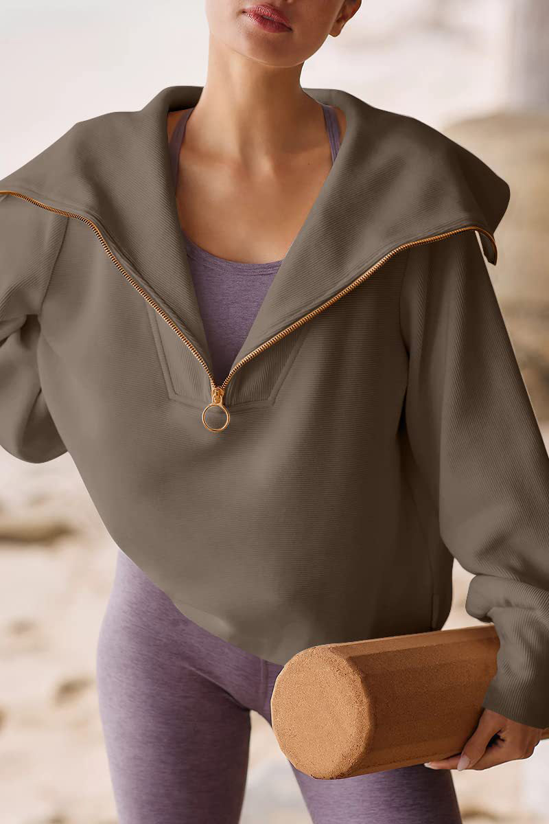 Women's relaxed-fit polyester sweater with fold-over collar and half zipper in chic versatile style