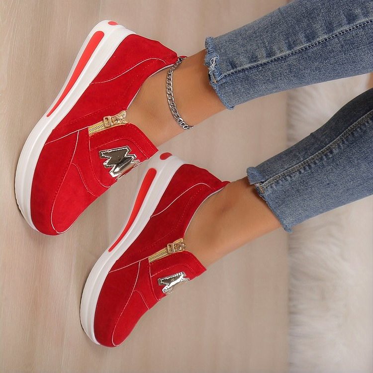 Women's white platform sneakers zip-up style with gold zipper accent and bold elevated sole