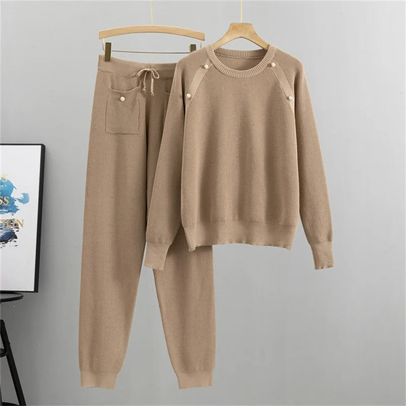 Beige relaxed-fit knit lounge two-piece set with pearl-accented sweater and matching jogger pants