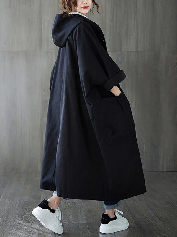 Women's oversized hooded longline coat in neutral tone with relaxed silhouette for cozy everyday layering