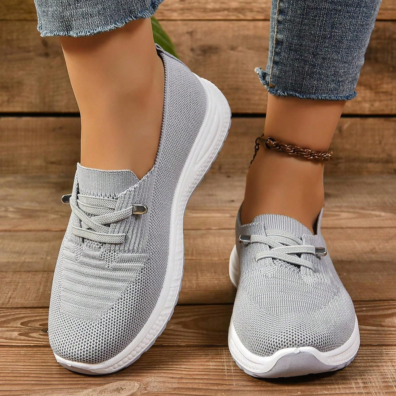 Women's gray slip-on knit orthopedic walking shoes with breathable upper and cushioned support