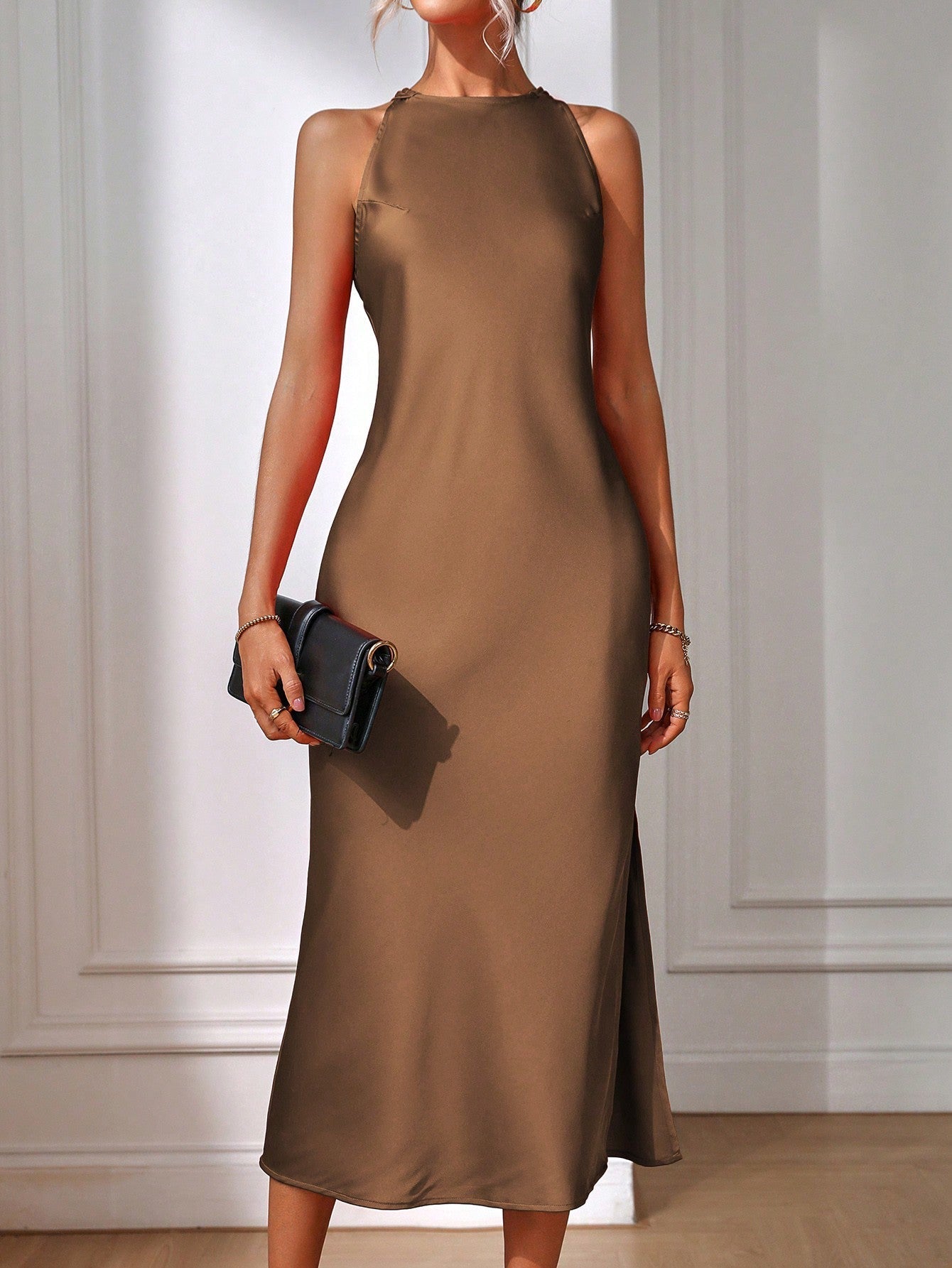 Sleeveless maxi dress with architectural back and side cutouts, regular fit, elegant formal silhouette