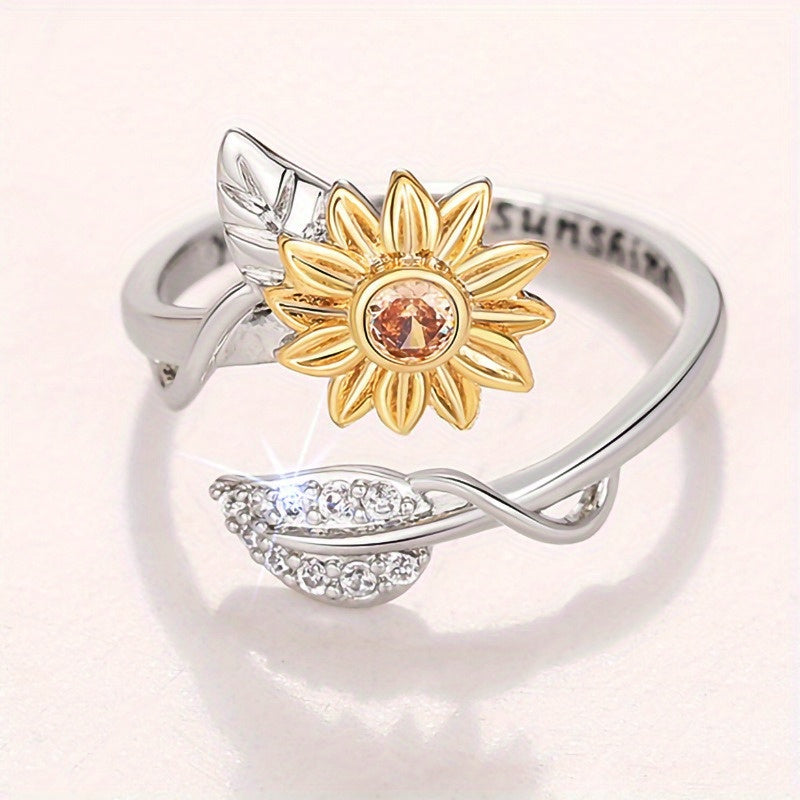 Gold-tone open band zircon ring with floral petals, bee motif, and sparkling cubic zirconia accents