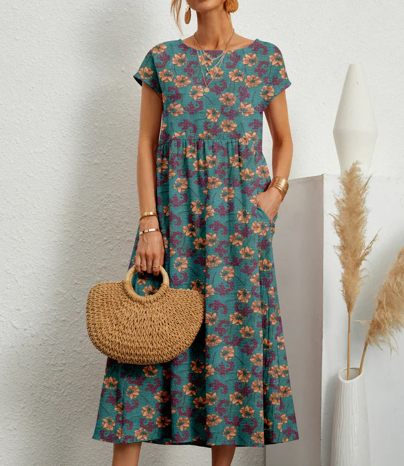 Boho midi dress with elastic waistband, relaxed silhouette, textured detailing, perfect for beach or brunch