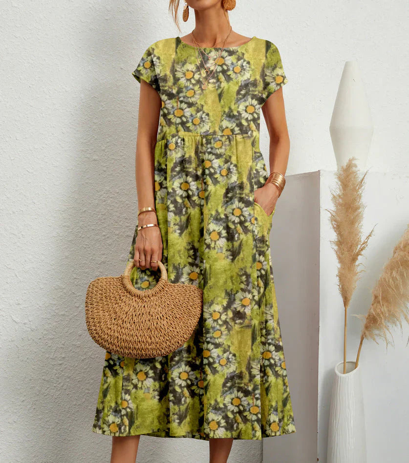 Boho midi dress with elastic waistband, relaxed silhouette, textured detailing, and practical pockets