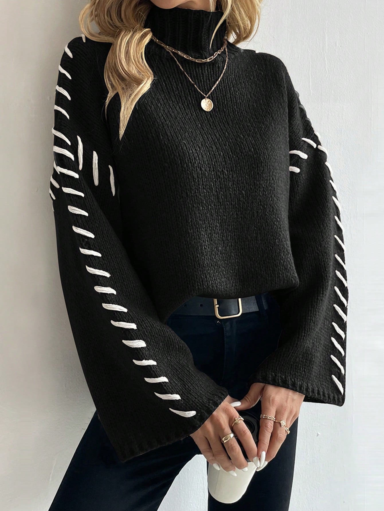 Women's patchwork knit turtleneck sweater in contrasting color-block design, casual-chic contemporary fit