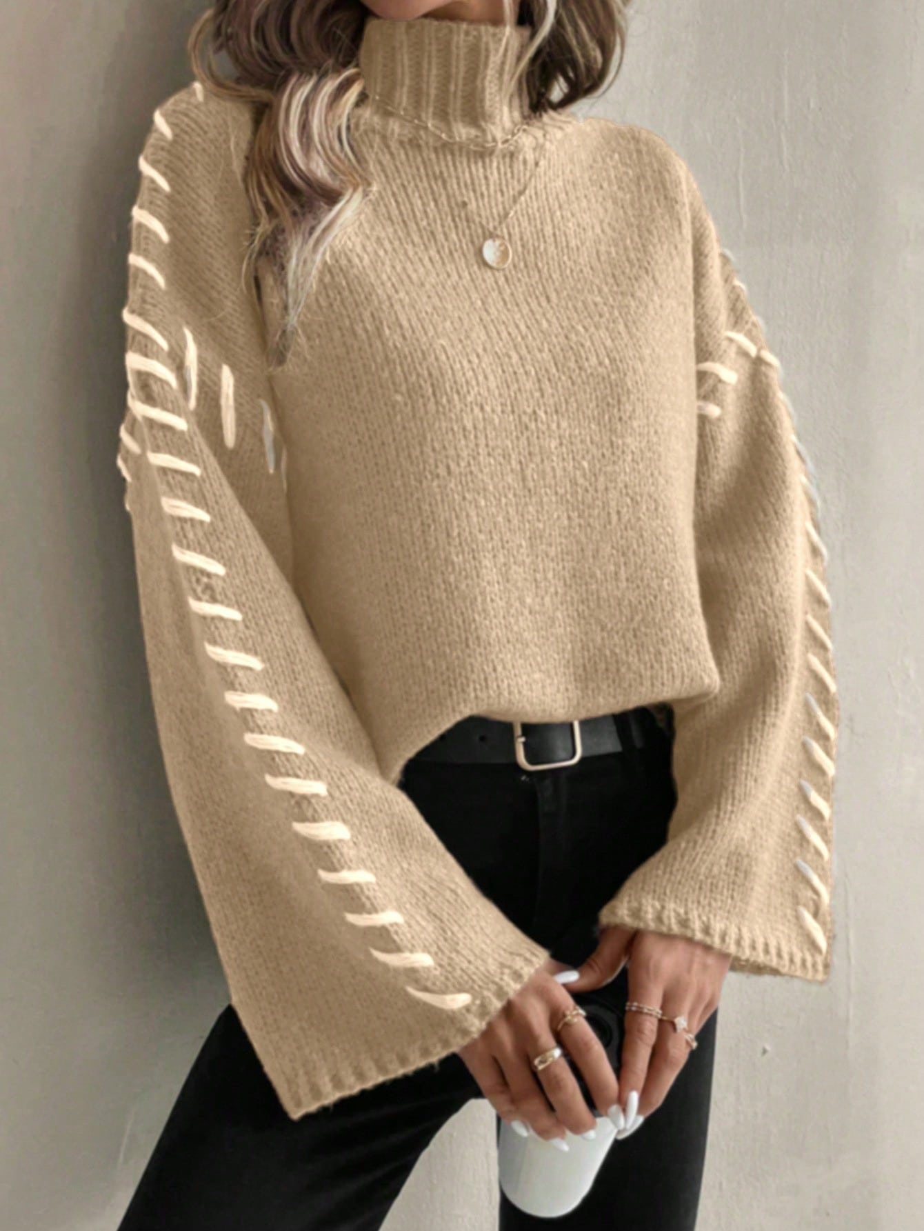 Women's patchwork knit turtleneck sweater in contrasting color-block design, casual-chic contemporary fit