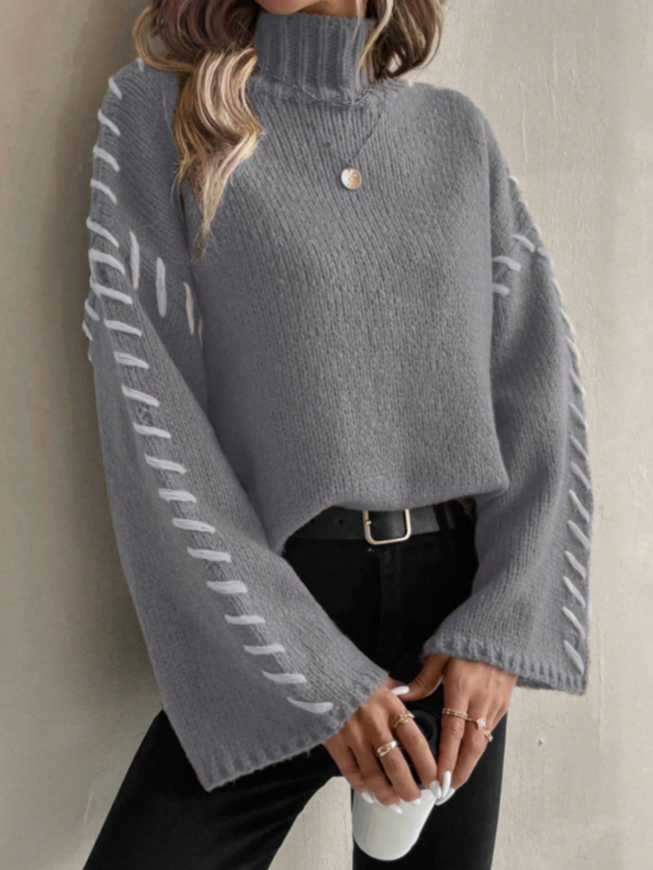 Women's patchwork knit turtleneck sweater in contrasting color-block design, casual-chic contemporary fit