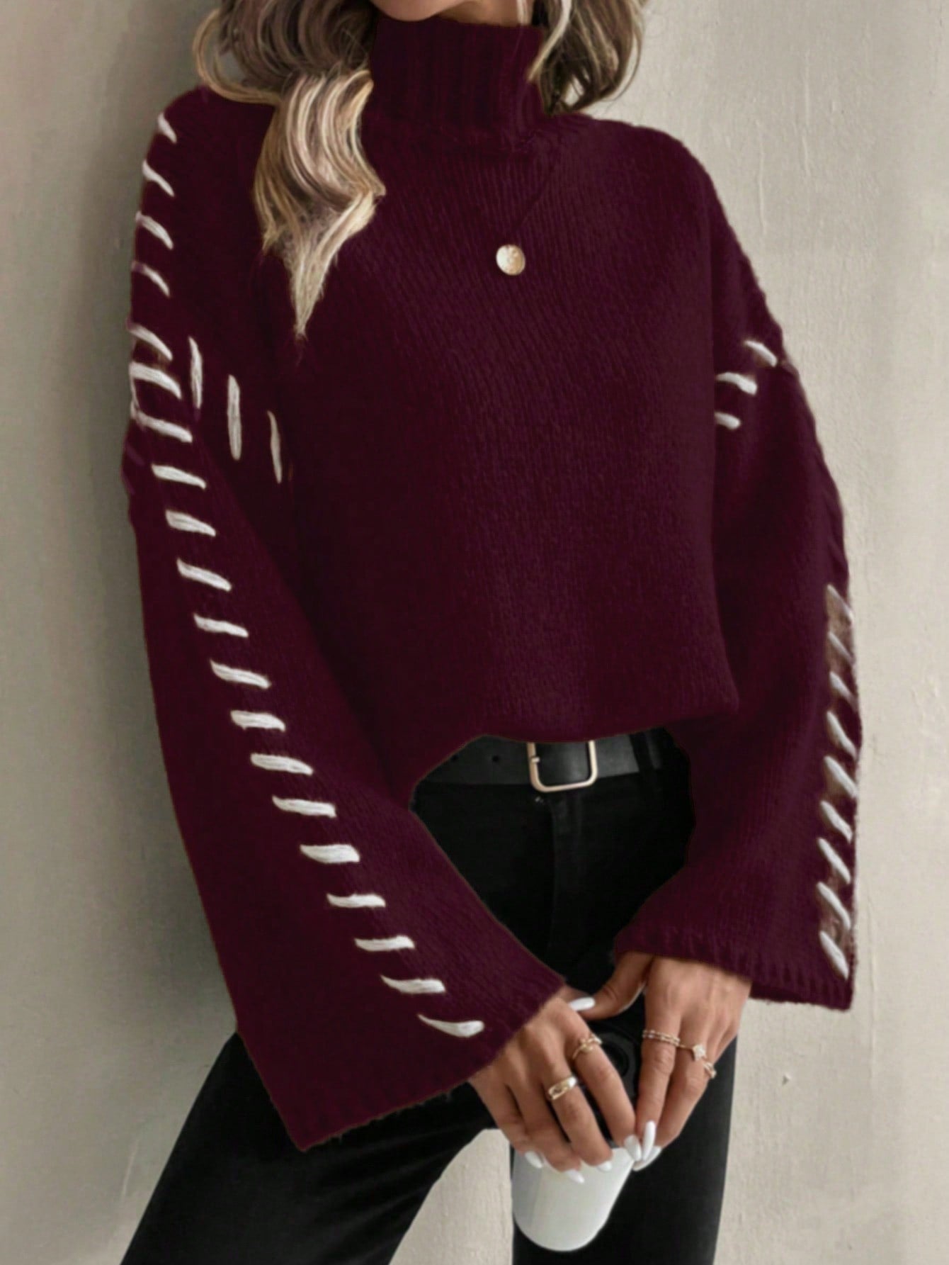 Women's patchwork knit turtleneck sweater in contrasting color-block design, casual-chic everyday style