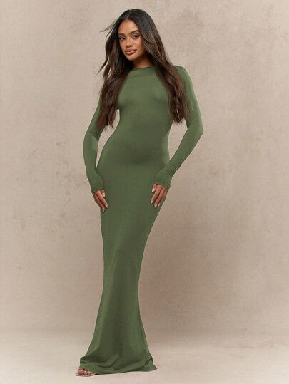 Women's black jersey maxi dress with long sleeves, round neck, and fishtail hem silhouette