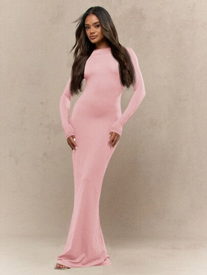 Women's black jersey maxi dress with long sleeves, round neck, and elegant fishtail hem silhouette