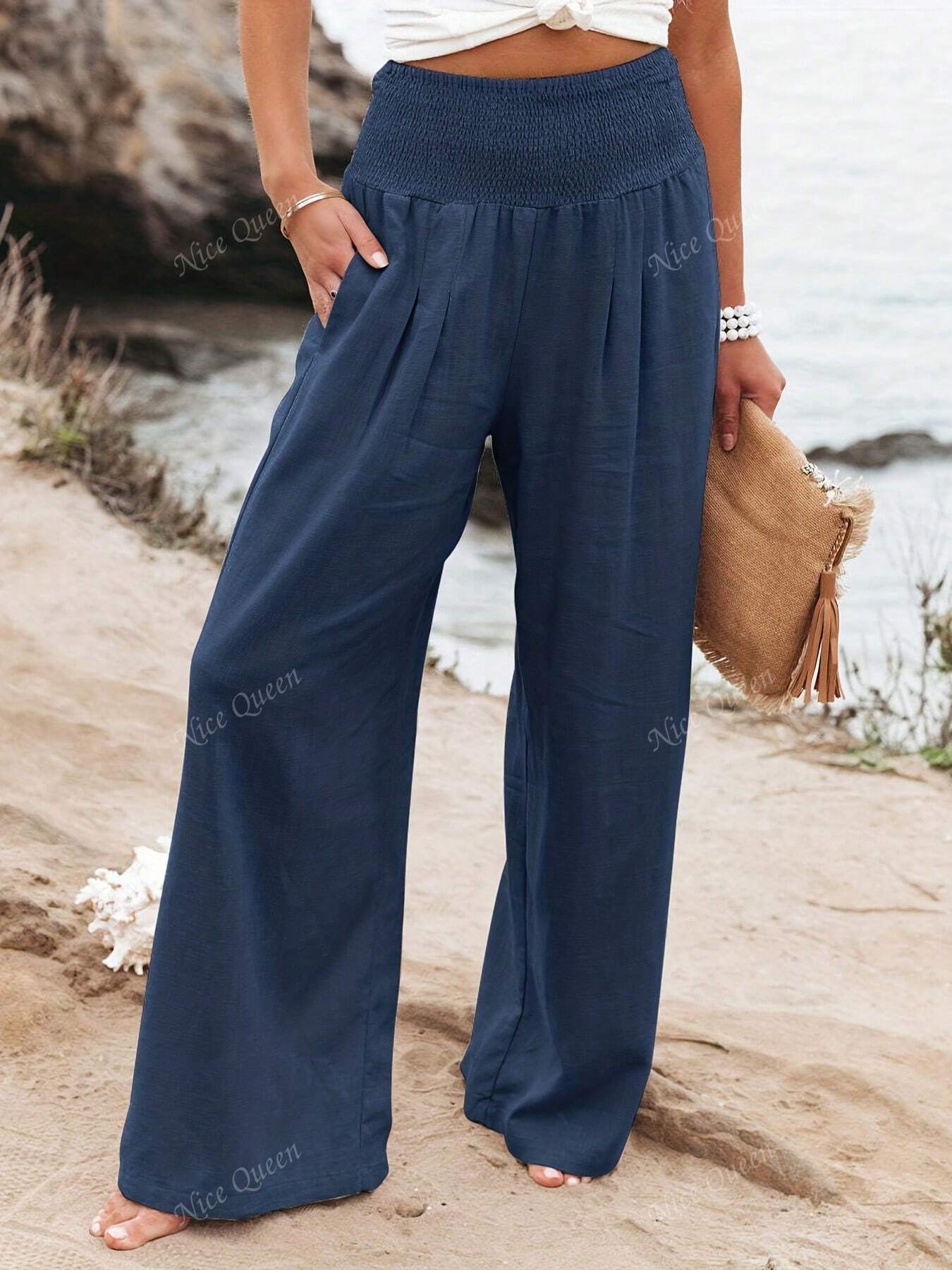 Women's wide leg linen-style pants in neutral tones, flattering relaxed fit with breathable lightweight fabric