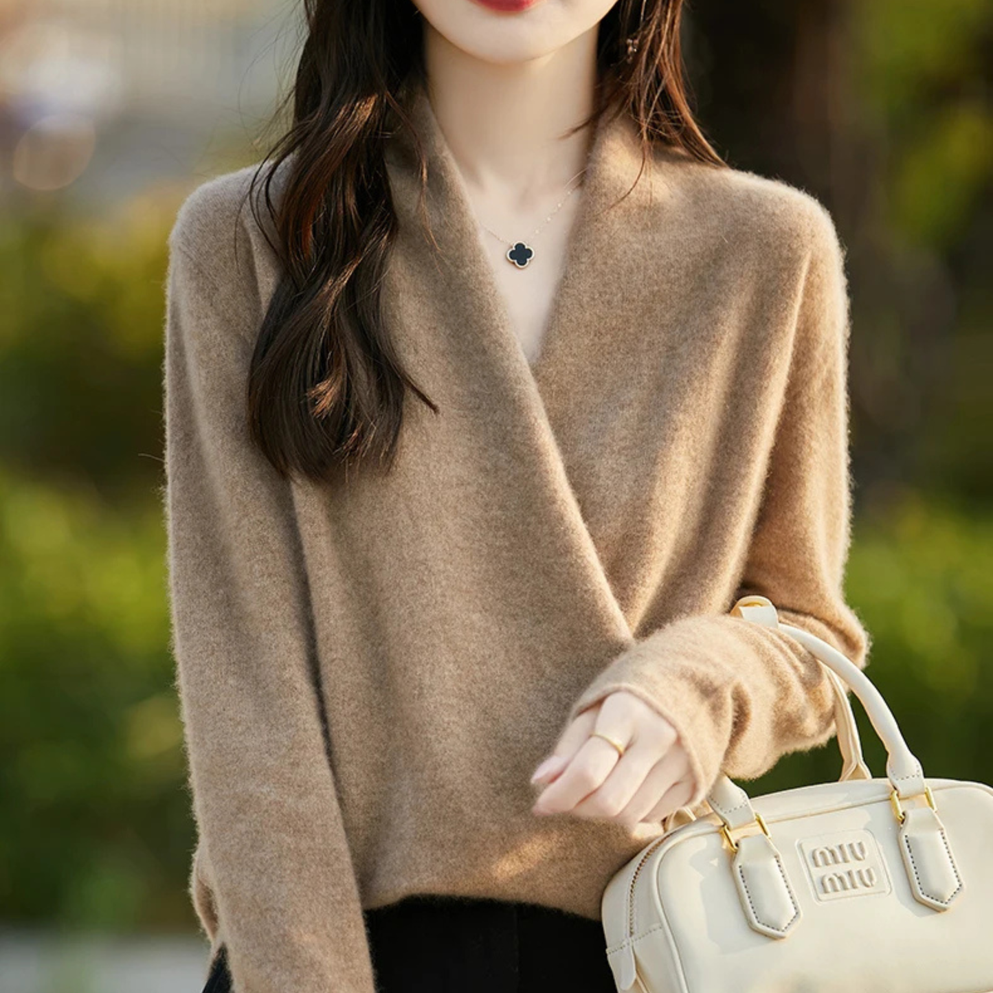 Women's merino wool wrap sweater in neutral tone, featherweight knit with crossover V-neckline