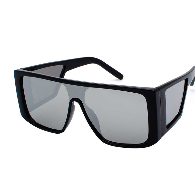 Oversized angular retro sunglasses with colored UV400 lenses, bold futuristic festival style