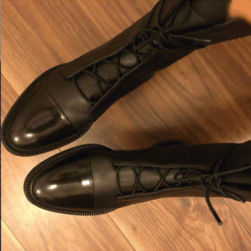Women's brown leather lace-up ankle boots with military-inspired style and polished shiny toe