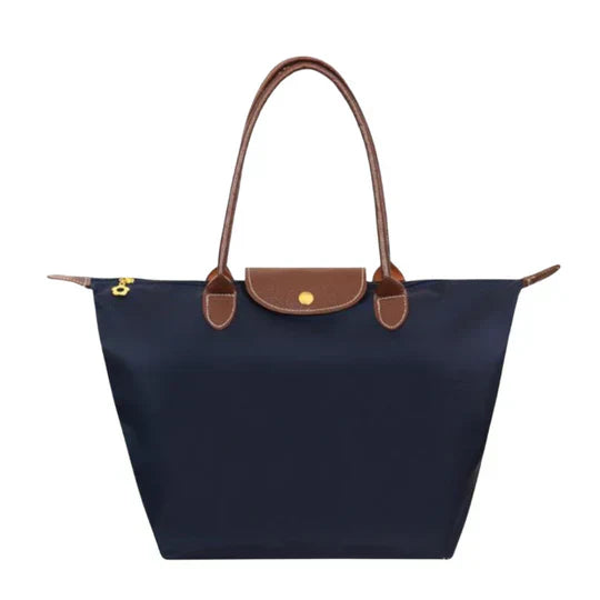 Structured black faux-leather luxury handle bag with clean silhouette for chic professionals