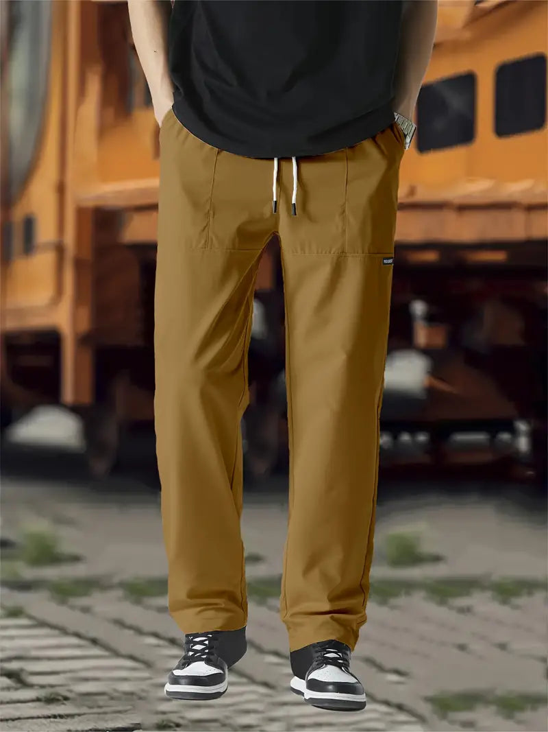 Men's relaxed fit casual pants with adjustable waistband, generous hip and thigh cut for all-day comfort