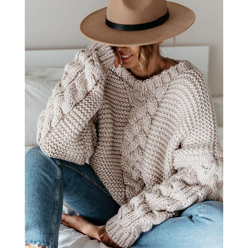 Oversized chunky cable knit sweater in cozy neutral tones with thick textured handcrafted detailing