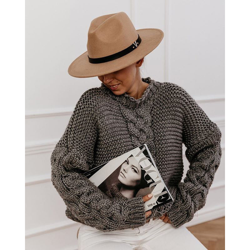 Oversized chunky cable knit sweater in cozy neutral tones with thick textured handcrafted detailing