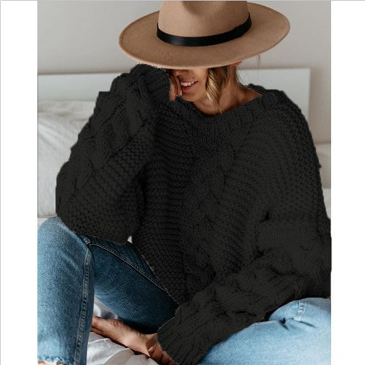 Oversized chunky cable knit sweater in cozy neutral tones with thick textured handcrafted detailing