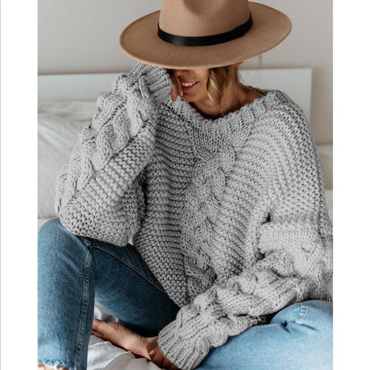 Oversized chunky cable knit sweater in cozy neutral tones with thick textured handcrafted detailing