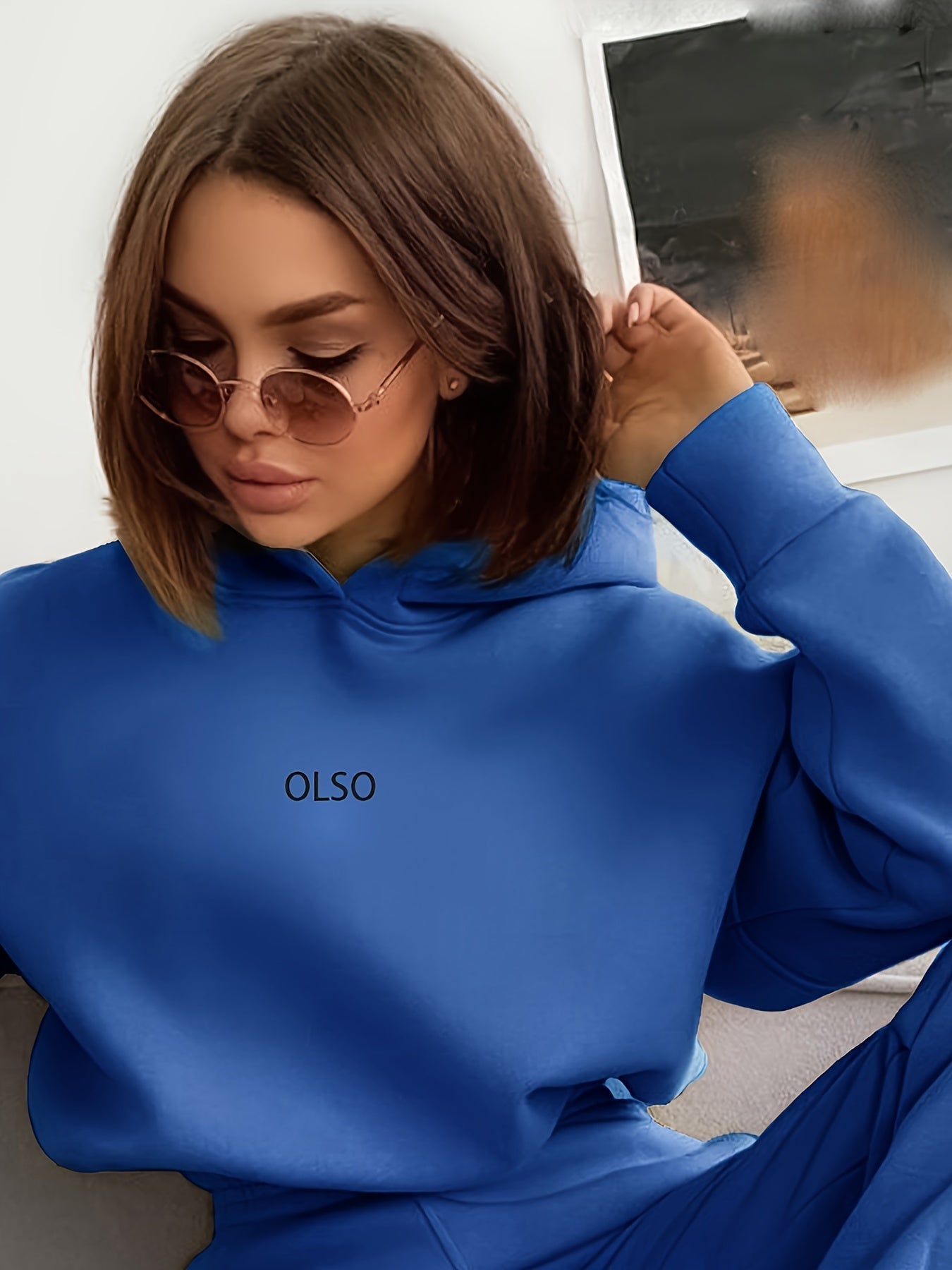 Women's sustainable two-piece hoodie and sweatpants tracksuit set in coordinated casual lounge style