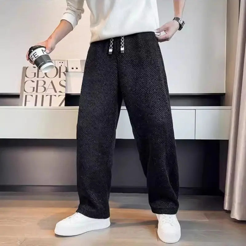 Men's tapered brushed knit pants in neutral tone, relaxed wide-leg fit with drawstring waist