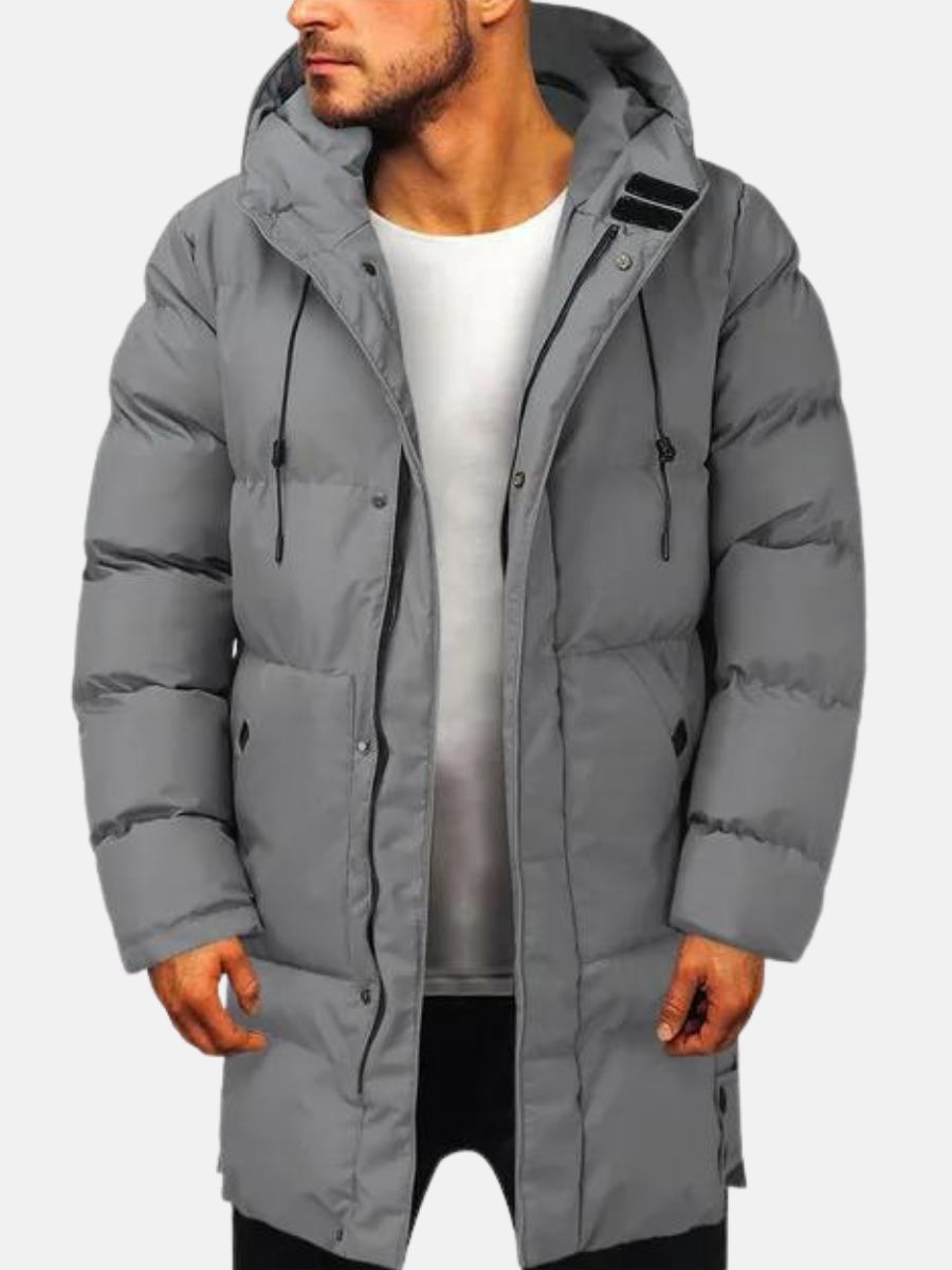 Men's longline black puffer jacket with hood and zipper pockets for cold weather warmth
