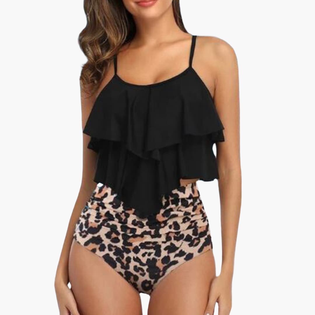 Women's navy blue ruffled tankini set with high-waisted tummy control bottom for beach comfort