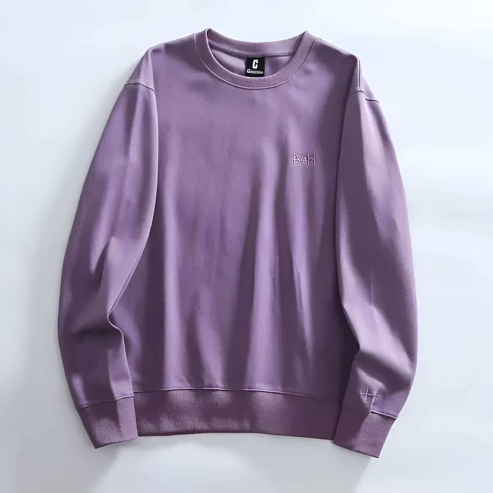 Minimalist crewneck sweatshirt soft fabric relaxed fit subtle embroidery everyday casual style