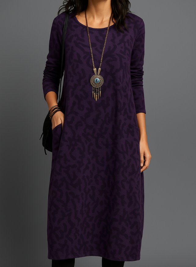 Women's casual midi dress with long sleeves, side pockets, and patterned hem in versatile everyday style