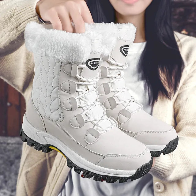 Women's mid-height quilted snow boots lace-up water resistant with cozy faux fur trim cuff