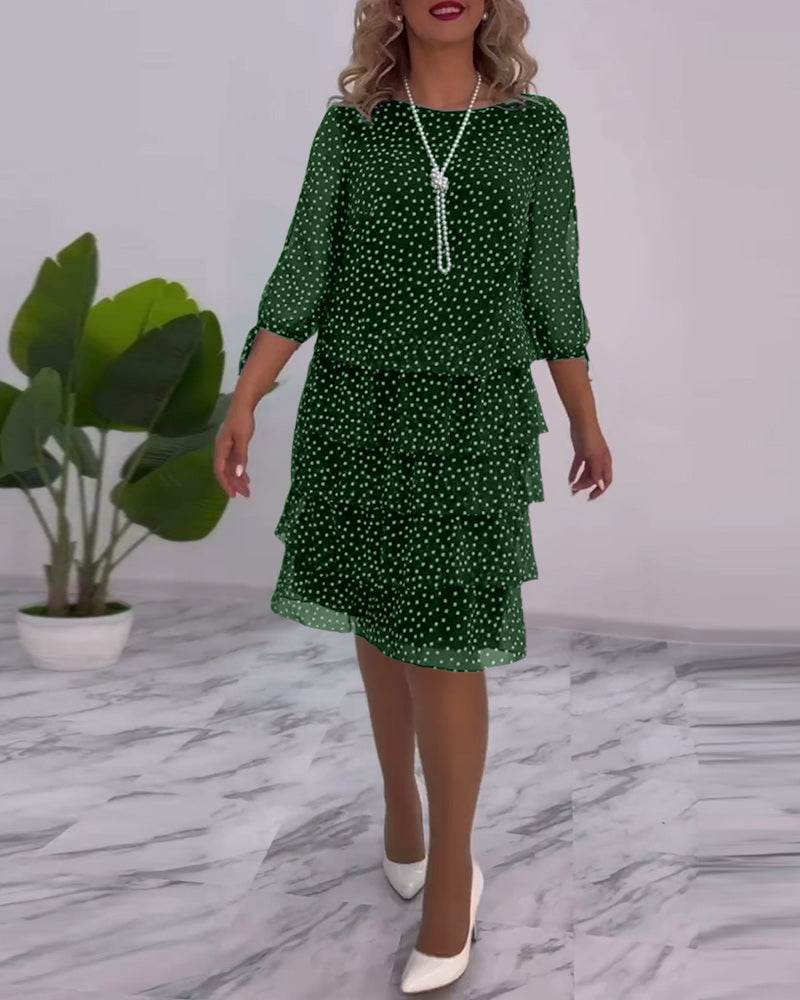 Women's black white polka dot midi dress elegant flowing silhouette timeless feminine style
