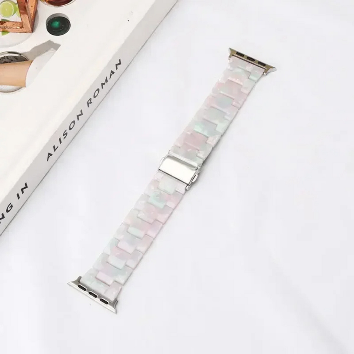 Bold marbled resin Apple Watch band with luminous high-gloss links and scratch-resistant adjustable design