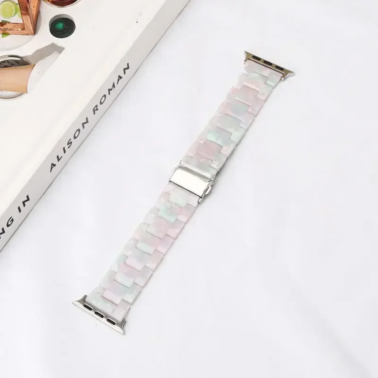 Bold marbled resin Apple Watch band with luminous high-gloss links and scratch-resistant adjustable design