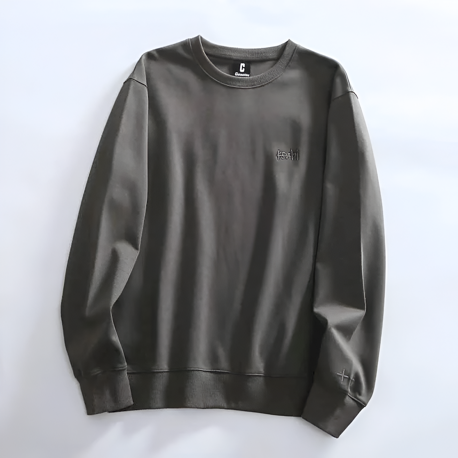 Minimalist crewneck sweatshirt soft fabric relaxed fit subtle embroidery everyday casual style