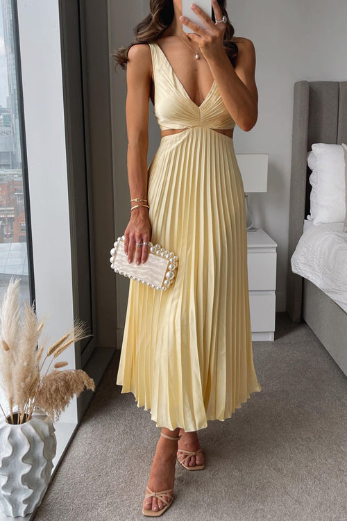 White sleeveless V-neck cotton dress with subtle waist cutouts, minimalist elegant silhouette